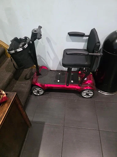 Red pre-loved folding mobility scooter